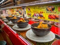 TOKYO, JAPAN -28 JUN 2017: Close up of assorted japanesse food over a table, inside of a kaitenzushi conveyor belt sushi