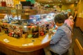 TOKYO, JAPAN -28 JUN 2017: Unidentified people eating an assorted japanesse food over a table, inside of a kaitenzushi