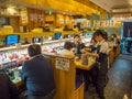 TOKYO, JAPAN -28 JUN 2017: Unidentified people eating an assorted japanesse food over a table, inside of a kaitenzushi