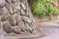 Dry stone retaining wall of Asuka-no-komichi slope and hydrangeas flowers. Royalty Free Stock Photo