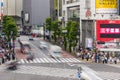 TOKYO, JAPAN - JUNE 21 2023: Long exposure single image of crowds using the famous Shibuya Crossing in Tokyo, Japan
