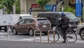 Delivery Cyclist In Tokyo Street, Japan