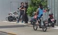 Japanese Mother Riding Bicycle, Tokyo, Japan