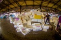 TOKYO, JAPAN JUNE 28 - 2017: Unidentified man working next to a pile of white boxes in Tsukiji Market is the biggest Royalty Free Stock Photo