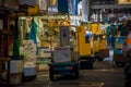TOKYO, JAPAN JUNE 28 - 2017: Unidentified workers with a small cargo yellow machine, inside of a Fish Market Tsukiji in
