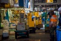 TOKYO, JAPAN JUNE 28 - 2017: Unidentified workers with a small cargo yellow machine, inside of a Fish Market Tsukiji in