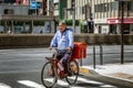 Tokyo, Japan, 04/12/2019: A man on a bicycle on a city street