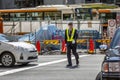 Tokyo, Japan, 04/12/2019: A man traffic controller on a city street