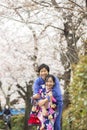 Tokyo, Japan- March 29,2019 an asian couple wearing traditional japanese clothes are having fun in blooming cherry blossom festiva Royalty Free Stock Photo