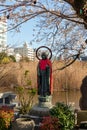 Bronze Jizo statue in front of the Shinobazunoike Bentendo temple in Ueno Park, Tokyo, Japan