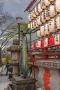Sculpture of Biwa, stone and paper lanterns in the Kaneiji temple of Ueno.