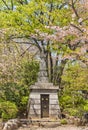 Buddhist stupa Shakyoto surrounding by cherry blossoms in Zojoji Temple. Royalty Free Stock Photo