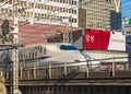 Japanese shinkansen bullet train and advertising signs of Tokyo Olympic Games.