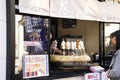 Japanese people and foreign traveler stand waiting line up for buy Dango or Japanese dumpling and sweet made from mochiko Royalty Free Stock Photo