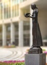 Statue of a woman holding a dove at Tokyo Metropolitan Government Building.