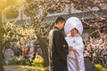 Traditional Japanese shinto wedding of a couple in black haori kimono and white shiromuku