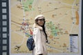 Traveler thai women pose portrait looking and reading map in Naritasan Omote Sando or Narita old town at Chiba in Tokyo, Japan