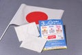 Japan flag with cloth masks and leaflet sent by govt to fight COVID-19.
