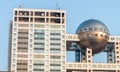 TOKYO, JAPAN - MAY 2016 : The futuristic Fuji TV Building in Odaiba. its futuristic metallic clad building featuring a massive si