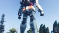 TOKYO, JAPAN - MAY 2016: Gundum Robot with tourists. Its most unique attraction is the Gundam Front Tokyo with various