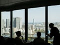 Tokyo, Japan - Silhouette of customers and waitress at executive lounge of Conrad Tokyo.