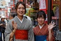 Smiling young japanese women in kimono dressing