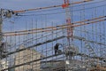 unidentified worker move on a scaffolding in the construction site of building near Shinjuku