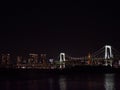 Tokyo, Japan - Night view of okyo skyline and Rainbow Bridge, a suspension bridge crossing northern Tokyo Bay. Royalty Free Stock Photo