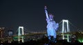 Tokyo, Japan 08.29.2017: nignt city view at the Rainbow Bridge and Odaiba Statue of Liberty on Odaiba island Royalty Free Stock Photo