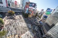 Tokyo, Japan - Nov 5, 2019: Crowded people walking, car traffic on Shibuya scramble crossing, high angle view Royalty Free Stock Photo