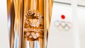 Tokyo, Japan - Nov 1, 2019: Gold trophy cup of Tokyo Summer Olympic 2020 show in Japan Olympic Museum, with Olympic games logo
