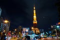 Tokyo, Japan - November 28, 2013: Busy street at night with Tokyo Tower Royalty Free Stock Photo