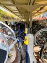 Tokyo, Japan - 18 November 2019: Crowded Bicycles with a cradle for a child at Bicycle parking in Tokyo