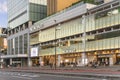 Modern glassed facade of the NEWoMan shopping center inside the JR Shinjuku Miraina Tower.