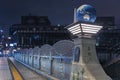Olympic Bridge or Gorinbashi decorated with an earth globe in Harajuku at night.