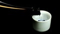 Pouring sake into guinomi cup