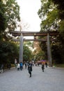 TOKYO, JAPAN - NOVEMBER 23, 2013 : Tourist visit The Torii Gate standing at the entrance to Meiji Jingu Shrine. Royalty Free Stock Photo