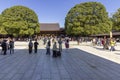 TOKYO, JAPAN - NOVEMBER 04, 2019: Visitors in Meiji Jingu, shinto shrine in Yoyogi park, Tokyo Royalty Free Stock Photo