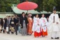 Young happy groom and bride during japanese traditional wedding ceremony at Meiji-jingu shrine in Tokyo, Japan on Royalty Free Stock Photo