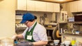 TOKYO, JAPAN - OCTOBER 31, 2017: Cook in the kitchen is cooking. Copy space for text. Royalty Free Stock Photo