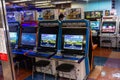 Tokyo, Japan, 26 October 2023: Gaming arcade with people playing on flight simulation machines