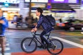 Night panning photography of unidentified man riding bicycle at Shibuya Square.The one of the wor