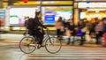 Night panning photography of unidentified woman riding bicycle at Shibuya Square.The one of the w