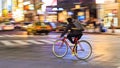 Night panning photography of unidentified woman riding bicycle at Shibuya Square.The one of the w