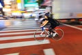 Night panning photography of unidentified woman riding bicycle at Shibuya Square.The one of the w