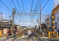 People walking or riding bicycle passing on a level crossing in the Kanegafuchi district.