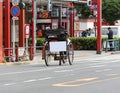 TOKYO, JAPAN - OCTOBER 31, 2017: Rickshaw with a sign for advertising on the streets of the city. Copy space for text.