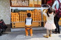 Unidentified children choosing snack at Nakamise Dori the shopping area of Sensoji temple the fam