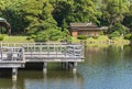 Wooden terrace above the pond of Hama-rikyÃÂ« Gardens with a Japanese chashitsu tea room.