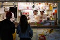 Tokyo, Japan, 04/08/2017: People buy ice cream at a kiosk in the entertainment center on Odaiba Island